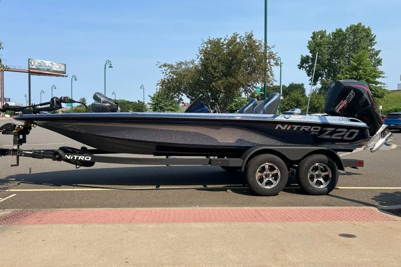 Slide: The Image of 2027 Nitro Z20 XL boat on trailer in parking lot, side view. - 1