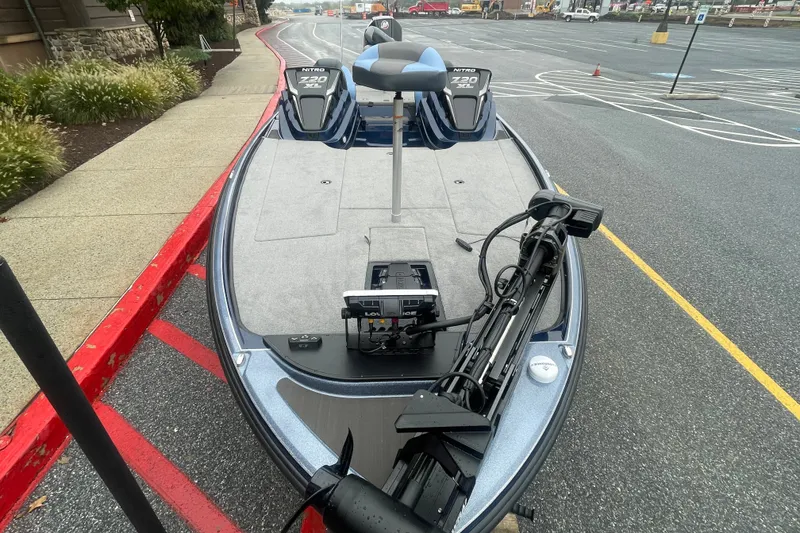 Slide: The Image of 2027 Nitro Z20 XL boat with advanced fishing equipment in a parking lot. - 2