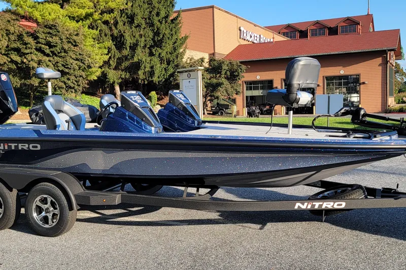 The Image of 2027 Nitro Z20 XL boat parked outside Tracker building, showcasing sleek design and modern features. - 0
