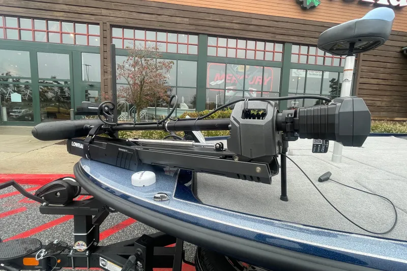 Slide: The Image of Nitro Z20 XL 2027 boat with Lowrance Ghost trolling motor, parked outside a store. - 3