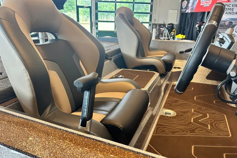 Slide: The Image of 2027 Nitro Z21 XL Pro boat interior with sleek seats and modern steering wheel design. - 17