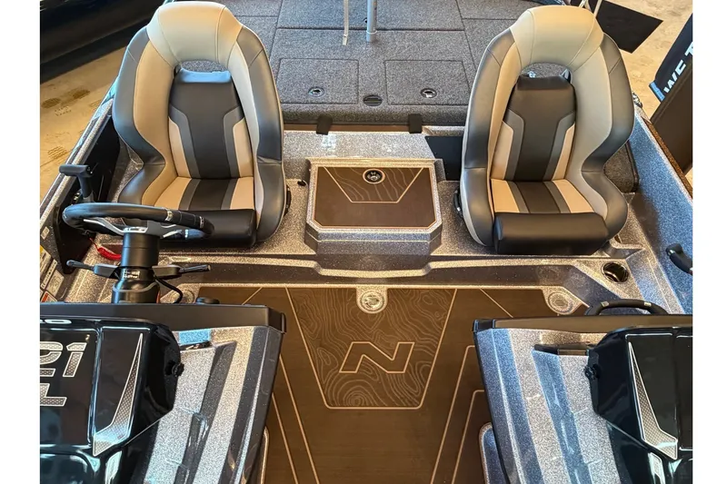 Slide: The Image of 2027 Nitro Z21 XL Pro boat interior with dual seats and steering wheel. - 1
