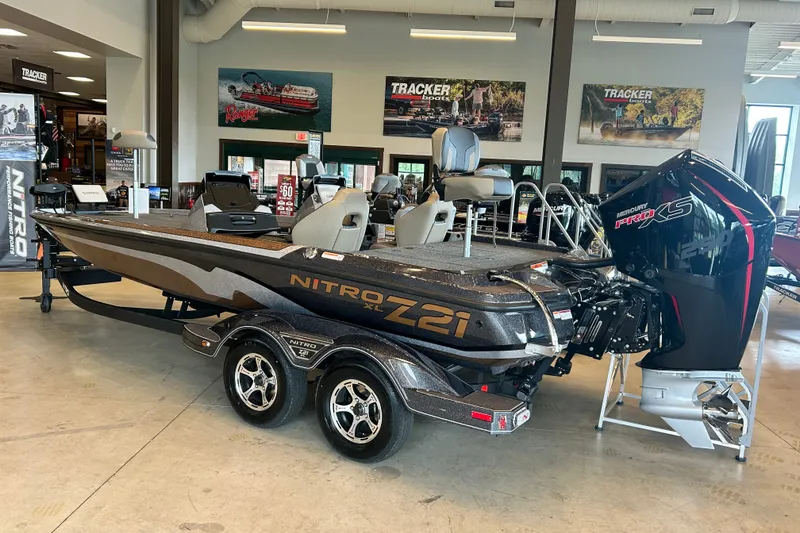 Slide: The Image of 2027 Nitro Z21 XL Pro boat displayed in showroom with Mercury Pro XS engine. - 5