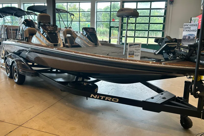 Slide: The Image of 2027 Nitro Z21 XL Pro boat displayed indoors on a trailer. - 7