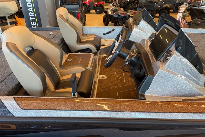 Slide: The Image of Interior of 2027 Nitro Z21 XL Pro boat with dual seats and modern dashboard. - 3