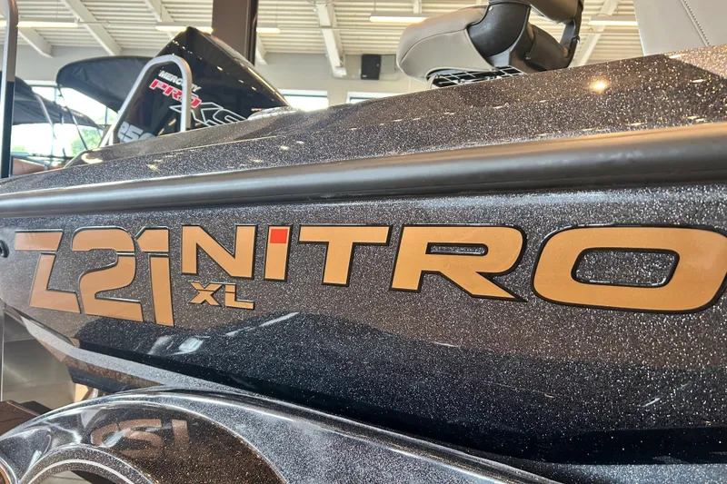 Slide: The Image of 2027 Nitro Z21 XL Pro boat with metallic finish in showroom. - 18