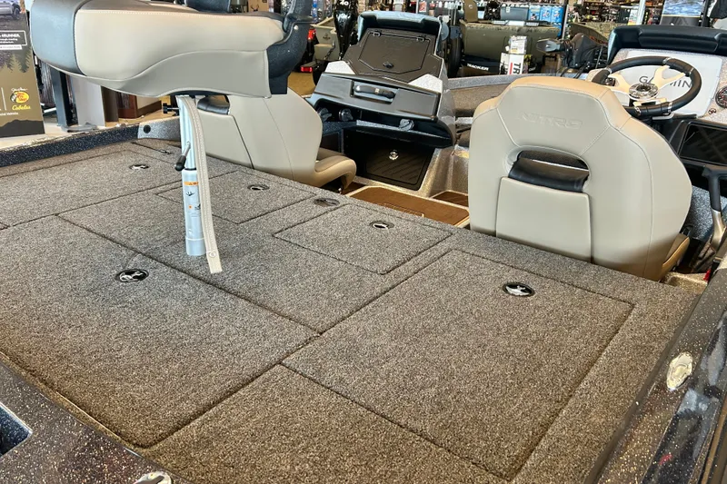 Slide: The Image of Interior of a 2027 Nitro Z21 XL Pro boat, featuring seating and storage compartments. - 15