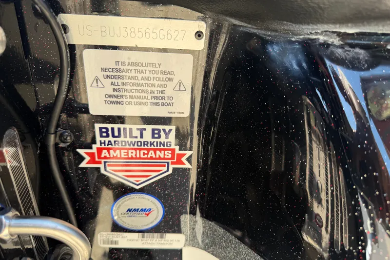 Slide: The Image of 2027 Nitro Z21 XL Pro boat label with safety instructions and "Built by Hardworking Americans" sticker. - 15