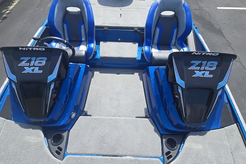 Slide: The Image of 2027 Nitro Z18 XL Pro boat interior with dual seats and steering console. - 3