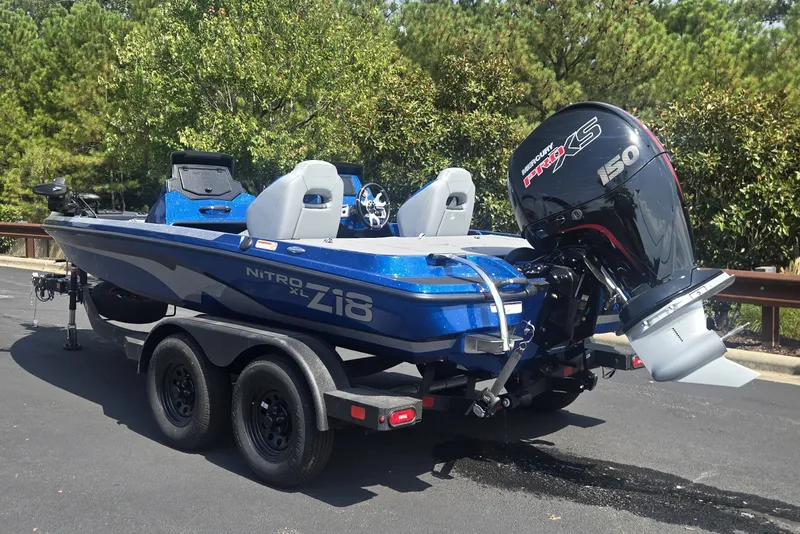 Slide: The Image of 2027 Nitro Z18 XL Pro boat with Mercury 150 engine, parked on a trailer. - 1