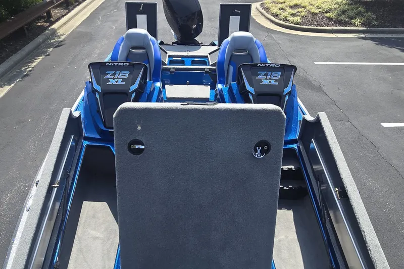 Slide: The Image of 2027 Nitro Z18 XL Pro boat interior with dual seats and carpeted deck. - 4