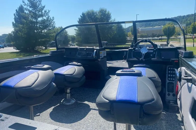 Slide: The Image of 2026 Ranger VX1888 WT boat interior with seating and steering console. - 2