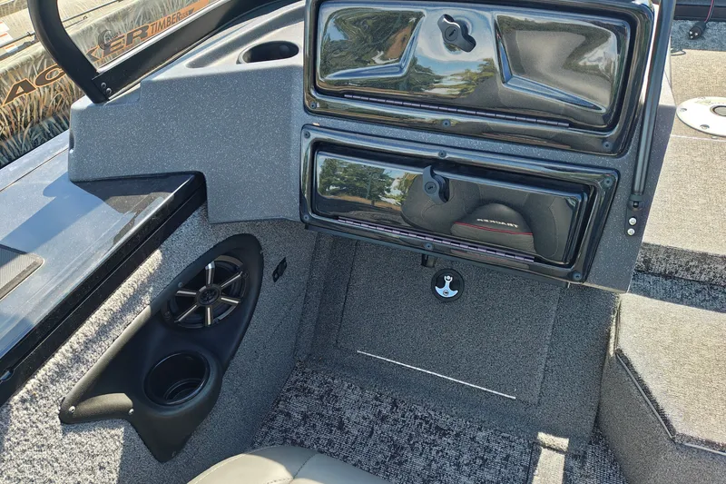 Slide: The Image of Interior of 2025 Tracker Targa V-18 WT boat with speaker and storage compartments. - 37
