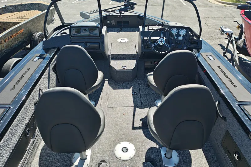 Slide: The Image of 2025 Tracker Targa V-18 WT boat interior with four seats and steering console. - 23
