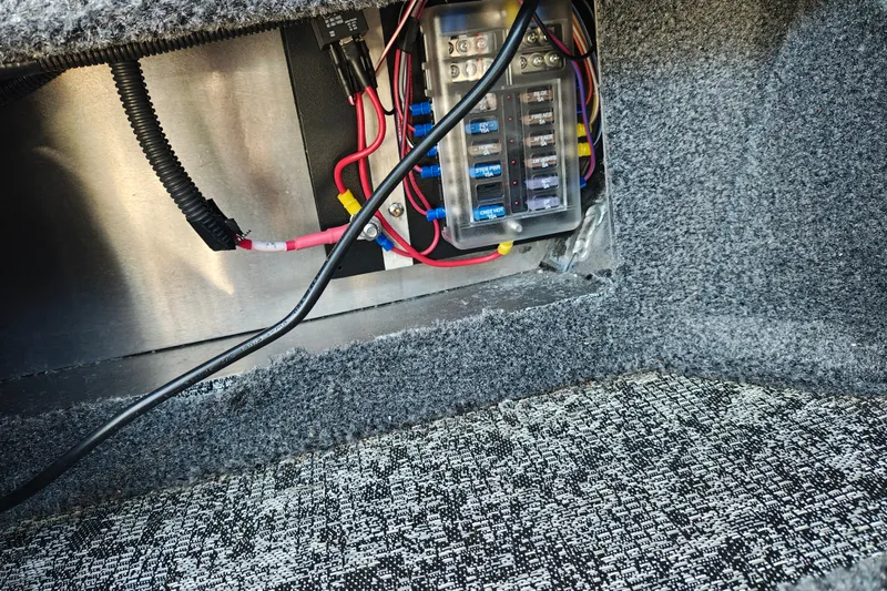 Slide: The Image of Electrical wiring and fuse box inside 2025 Tracker Targa V-18 WT boat. - 36