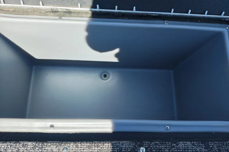 Slide: The Image of Empty storage compartment in 2025 Tracker Targa V-18 WT boat. - 19