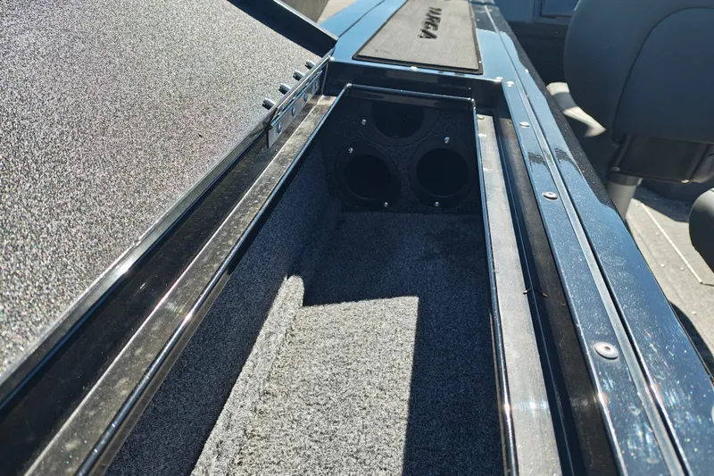 Slide: The Image of 2025 Tracker Targa V-18 WT boat interior storage compartment with carpeted finish. - 27