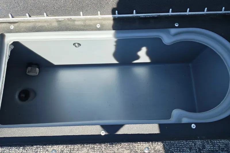 Slide: The Image of 2025 Tracker Targa V-18 WT boat storage compartment, featuring a spacious, durable interior design. - 21
