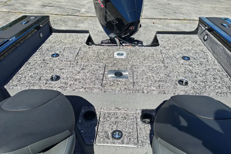 Slide: The Image of 2025 Tracker Targa V-18 WT boat interior with motor and seating. - 16