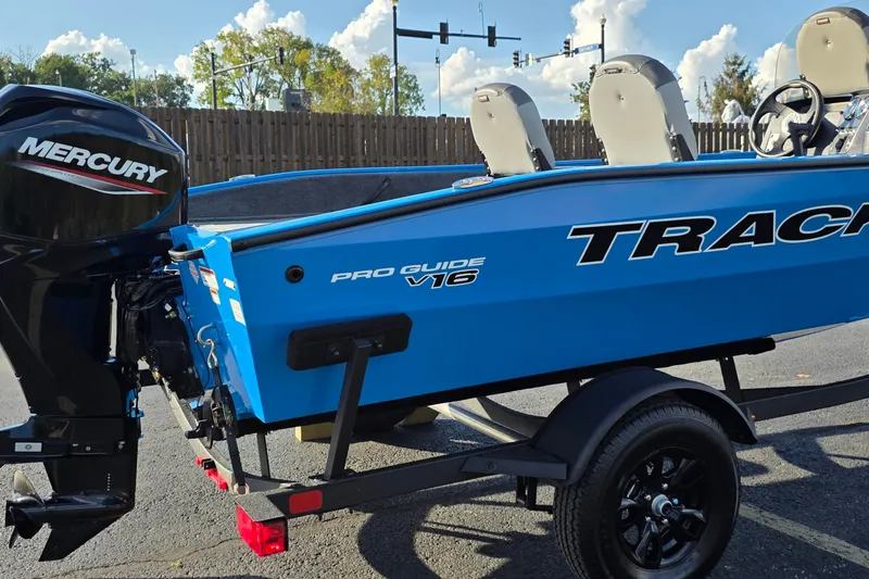 Slide: The Image of 2027 Tracker Pro Guide V-16 SC boat with Mercury engine on trailer. - 45