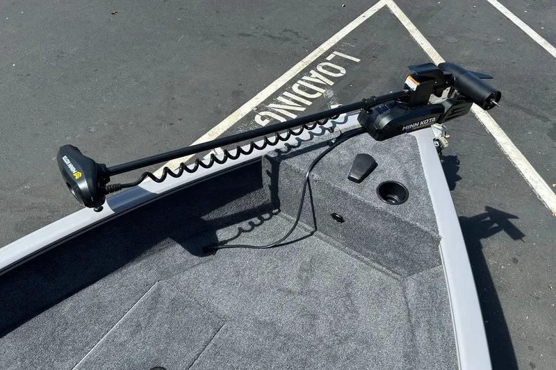 Slide: The Image of 2027 Tracker Super Guide V-16 SC boat with Minn Kota trolling motor in parking lot. - 39