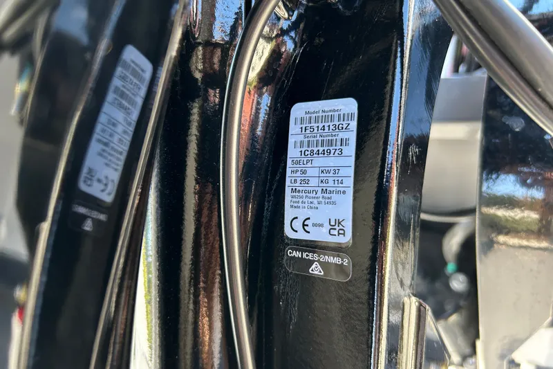 Slide: The Image of Close-up of a Mercury Marine engine label on a 2027 Tracker Super Guide V-16 SC. - 44