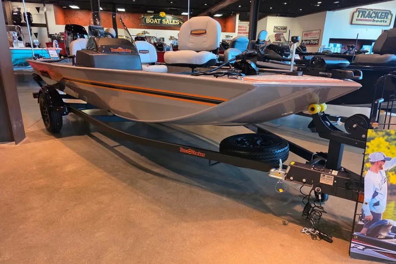 The Image of 2027 Tracker Bass Tracker Classic Limited boat displayed in showroom with trailer. - 0