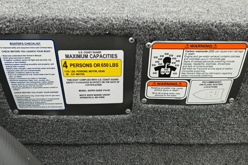 Slide: The Image of Tracker Super Guide V-16 SC 2027 boat safety labels and capacity warnings. - 16