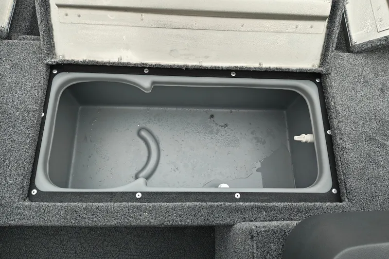 Slide: The Image of 2027 Tracker Super Guide V-16 SC boat storage compartment, open and empty. - 20