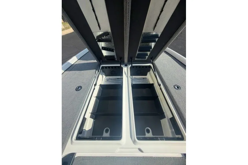 Slide: The Image of Open storage compartments on a 2027 Nitro Z21 XL Pro boat deck. - 10