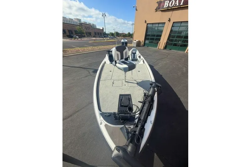 Slide: The Image of 2027 Nitro Z21 XL Pro boat parked outside a showroom on a sunny day. - 4