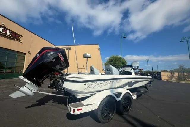 Slide: The Image of 2027 Nitro Z21 XL Pro boat on trailer, parked outdoors under a clear blue sky. - 1