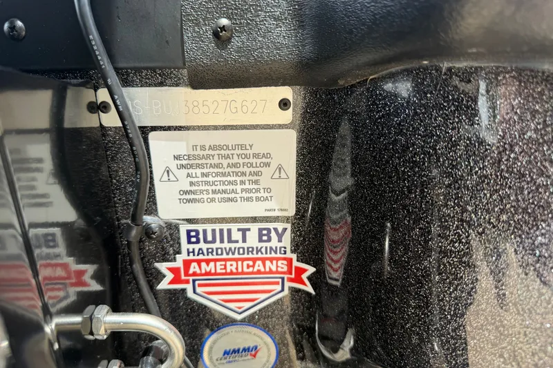 Slide: The Image of 2027 Nitro Z19 XL Pro boat with safety and "Built by Hardworking Americans" stickers. - 14