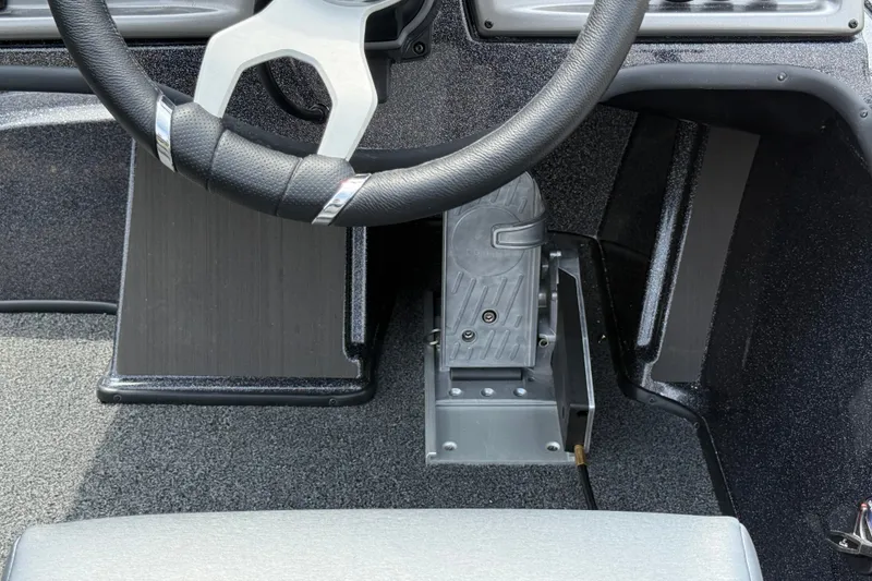 Slide: The Image of Steering wheel and pedal of 2027 Nitro Z19 XL Pro boat interior. - 13