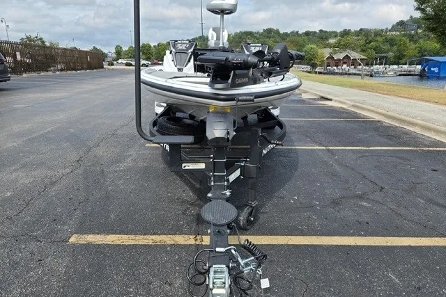 Slide: The Image of 2027 Nitro Z21 XL Pro boat parked in a lot, featuring advanced Garmin equipment. - 5