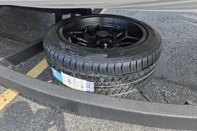 Slide: The Image of 2027 Nitro Z21 XL Pro tire on black alloy wheel, displayed on pavement. - 12