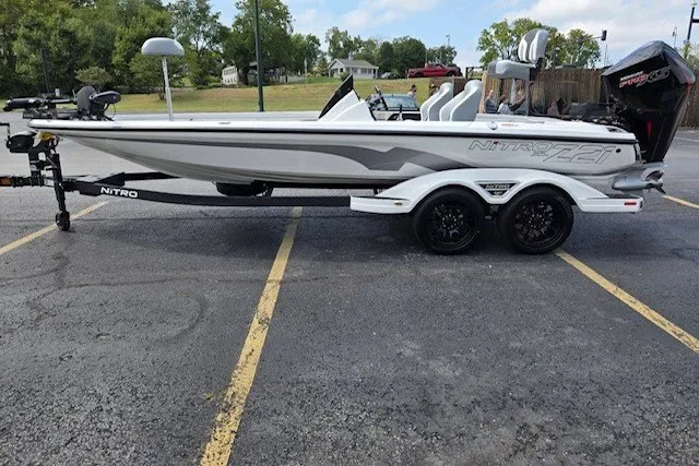 Slide: The Image of 2027 Nitro Z21 XL Pro boat on trailer in parking lot. - 1
