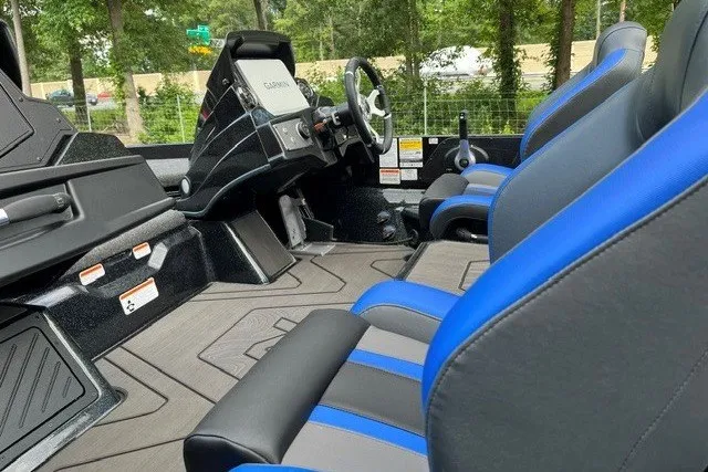 Slide: The Image of 2027 Nitro Z21 XL Pro boat interior with blue and black seating, modern dashboard, and steering wheel. - 14