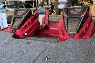 Slide: The Image of 2027 Nitro Z19 XL Pro boat with dual consoles and red accents in showroom. - 2