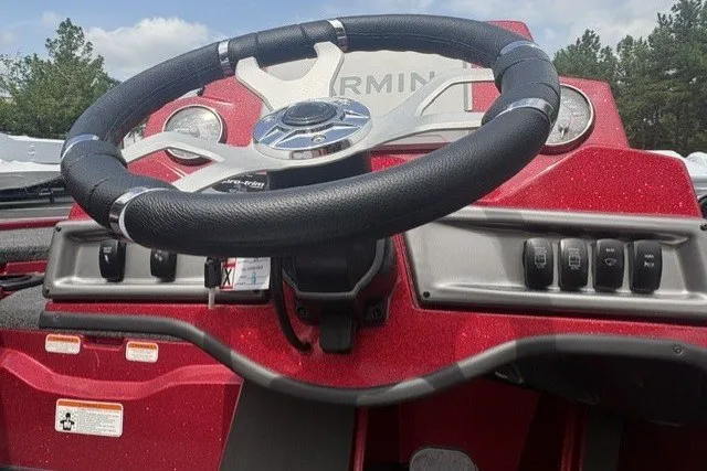 Slide: The Image of Steering wheel of a 2027 Nitro Z19 XL Pro boat with control panel. - 9