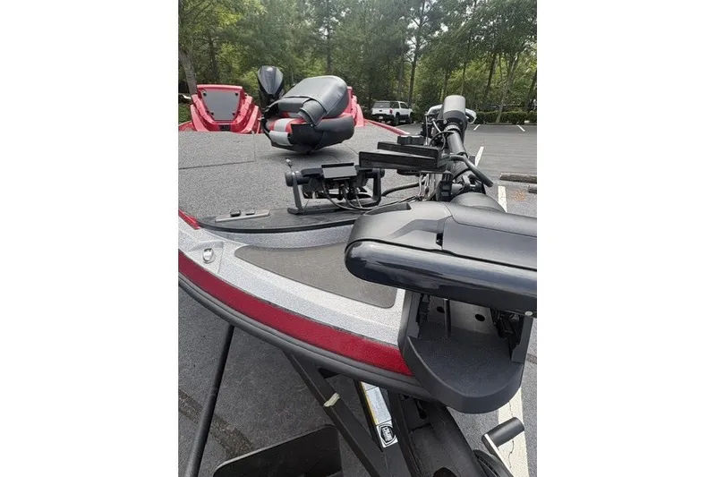 Slide: The Image of 2027 Nitro Z19 XL Pro boat with advanced fishing equipment in a parking lot. - 5