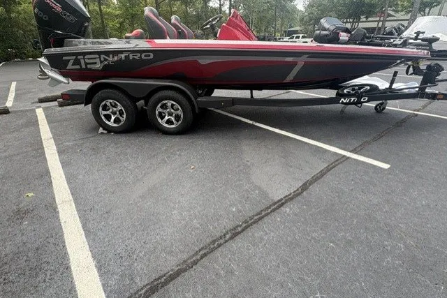 The Image of 2027 Nitro Z19 XL Pro boat on trailer in parking lot. - 0