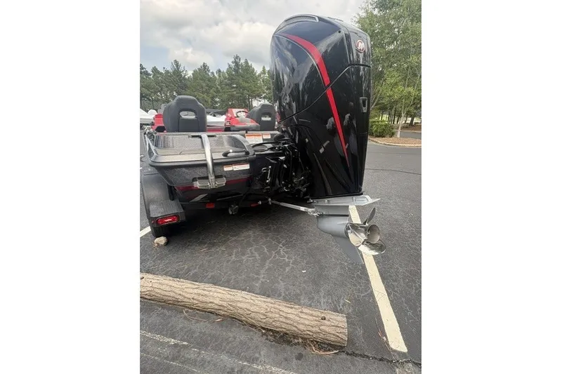 Slide: The Image of 2027 Nitro Z19 XL Pro boat with powerful outboard motor in parking lot. - 6