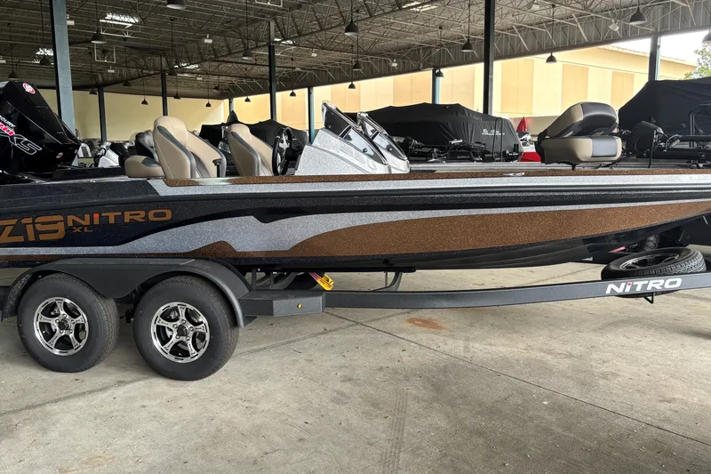 The Image of 2027 Nitro Z19 XL Pro boat on trailer in indoor showroom. - 0