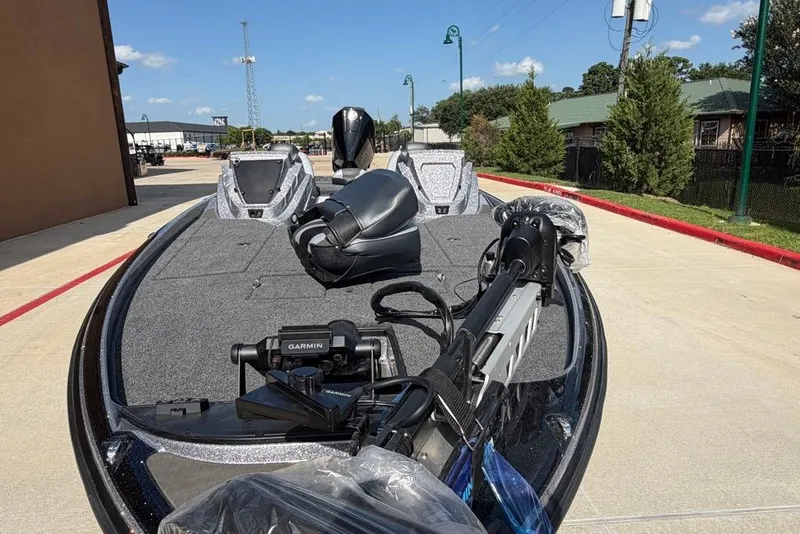 Slide: The Image of 2027 Nitro Z21 XL Pro boat with Garmin equipment, parked outdoors on a sunny day. - 13