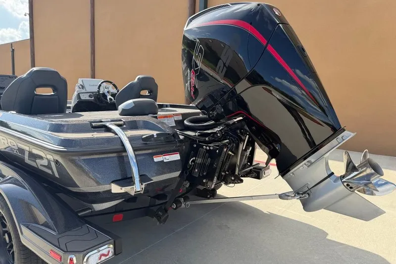 Slide: The Image of 2027 Nitro Z21 XL Pro boat with powerful outboard motor, sleek design. - 22