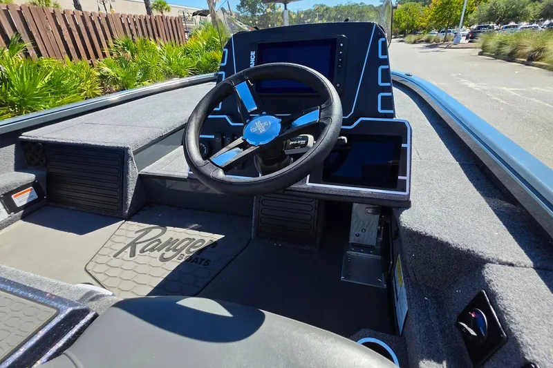 Slide: The Image of Interior of 2026 Ranger ALPHA 208 boat with steering wheel and dashboard display. - 16