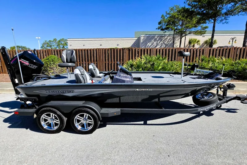 Slide: The Image of 2026 Ranger ALPHA 208 boat on trailer, parked outdoors, featuring sleek design and modern equipment. - 9