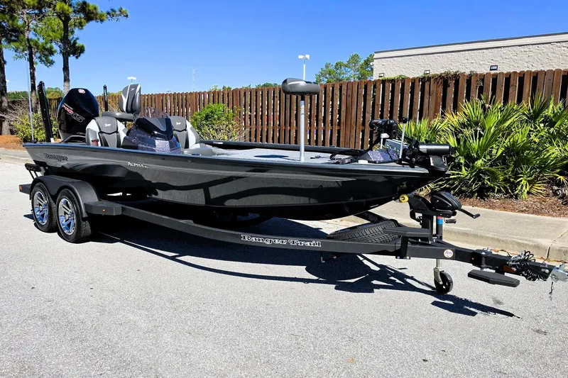 Slide: The Image of 2026 Ranger ALPHA 208 boat on trailer, parked outdoors, sunny day. - 8