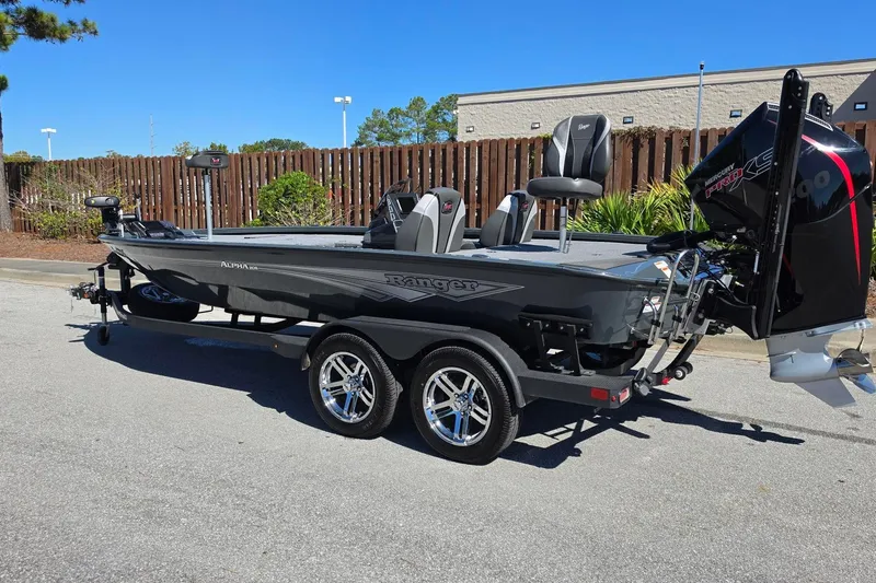Slide: The Image of 2026 Ranger ALPHA 208 boat with dual seats and powerful outboard motor. - 13